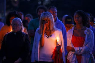 People gather at a vigil at Lynnhurst Park after a shooting at the Annunciation Catholic School Wednesday, 27 August 2025, in Minneapolis